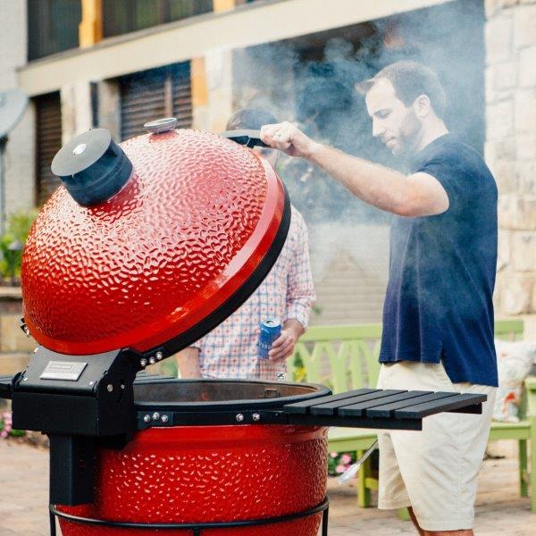 Aluminum side shelves installed on a Kamado Joe grill