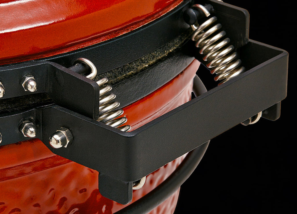 Closeup of the spring hinge on the back of the grill dome