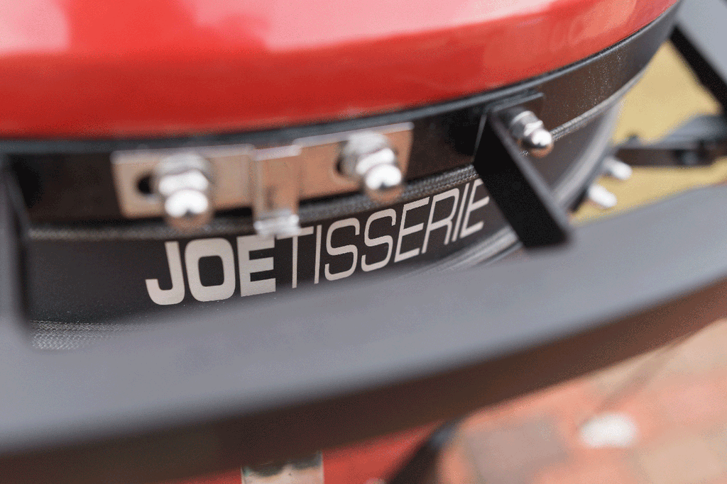 The JoeTisserie is designed so you can close your grill while using it