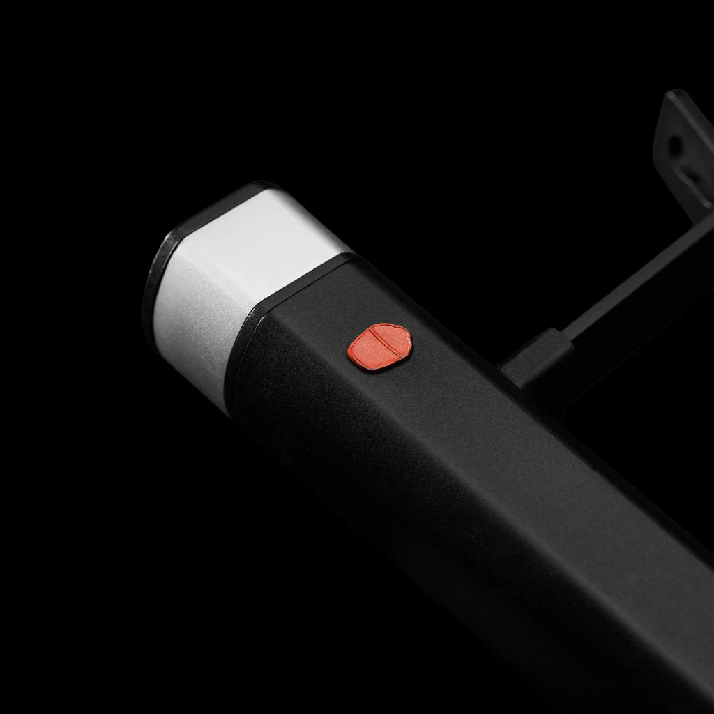 Close-up off the on/off power button on the left end of the top of the handle.
