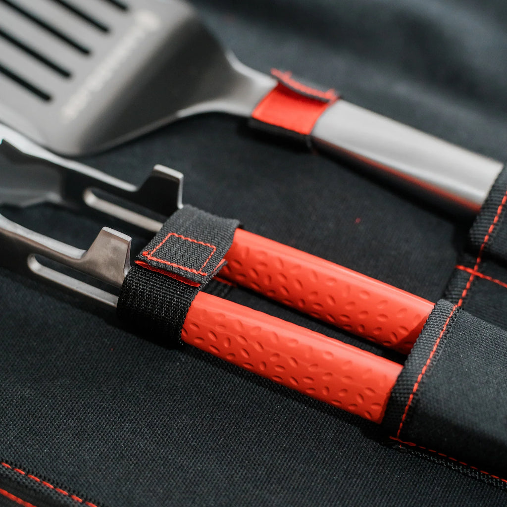 Extreme closeup of the velcro tabs that hold the tools in place in their pockets.