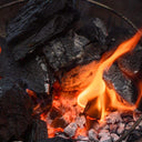 XL lump charcoal burning in the firebox