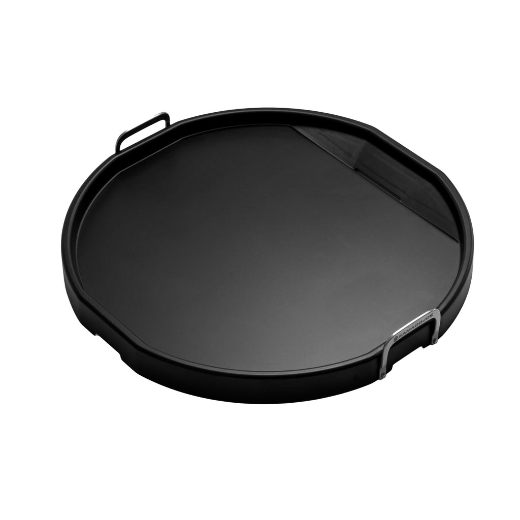 Round griddle with 2 vertical loop handles and grease drain on one side away from the handles