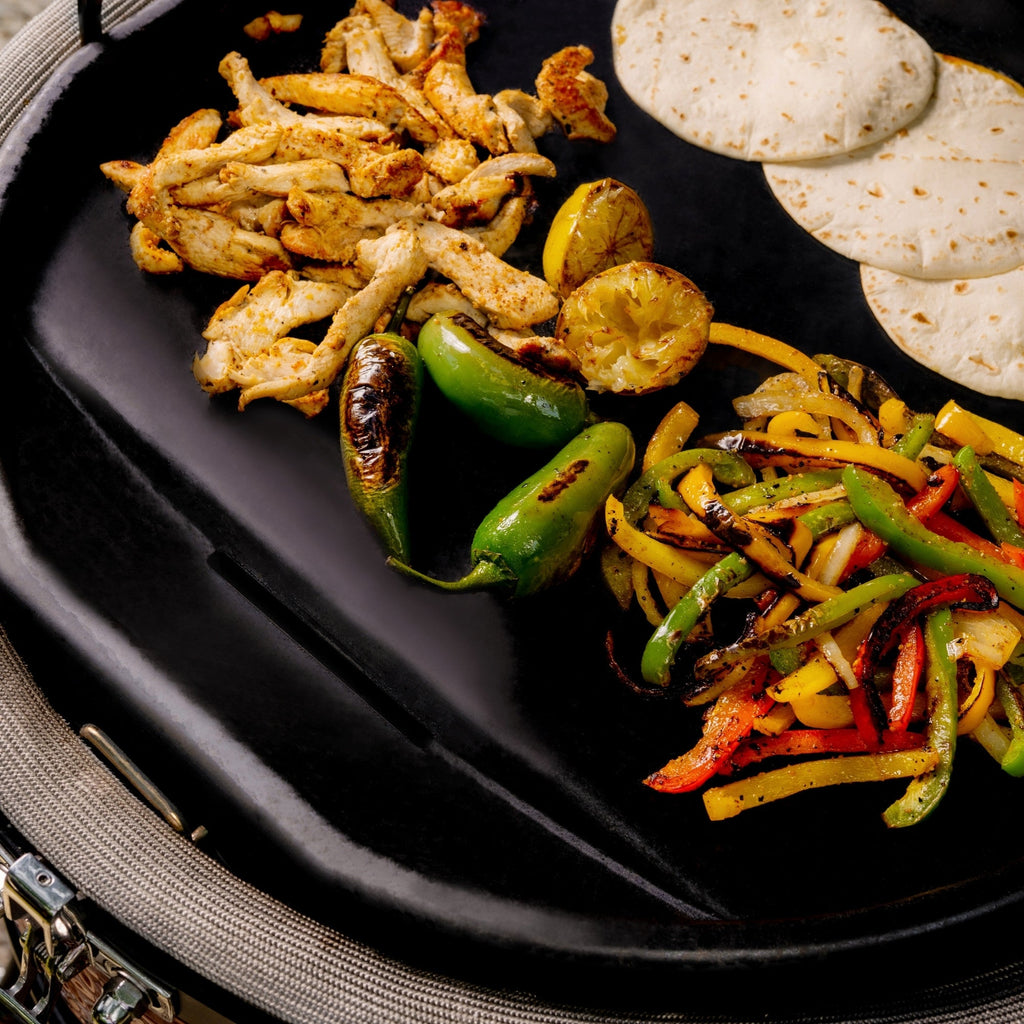 Cooking fajitas on griddle set into grill. The griddle edge is flush with grill edge.