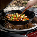 Cooking with wok placed in Kamado Joe accessory rack inside grill. Wok bottom rests in center circle of accessory rack.