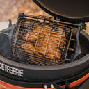 Spatchcocked chicken cooking inside the basket