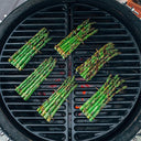 Asparagus being cooked on 2 Kamado Joe Half Moon Cast Iron Cooking Grates