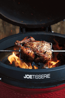 Chicken being cooked on the Kamado Joe rotisserie, the JoeTisserie